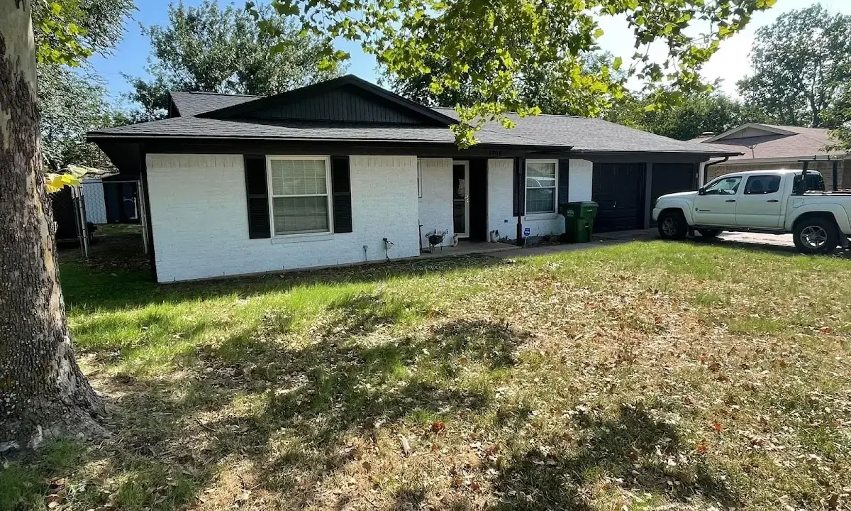 Professional roofing crew working on a residential roof in Haysville